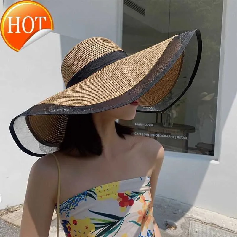 メッシュエッジビーチの日焼け止めとサンシェード付きストローを覆う新しい韓国語バージョンの汎用性のある顔を覆う夏の大きないっぱいの帽子
