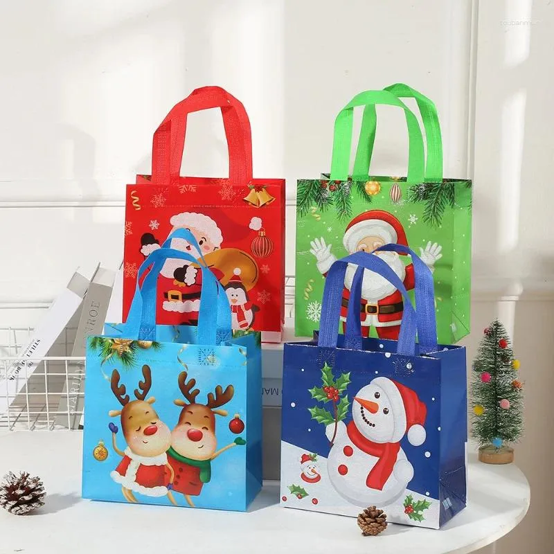 غلاف الهدايا 10pcs/Lot Christmas Candy Bag مقاومة للماء من النسيج غير المنسوجة من شوكولاتة التجميل تخزين التغليف سنة التغليف الأطفال