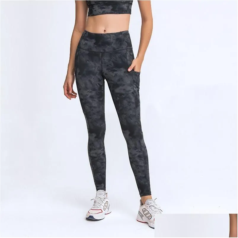 Dames trainingspakken l021 dames yogabroek met pocket girls running outfit fitness panty leggings Solid Color Lady High Taille Sports Tr OTWXM