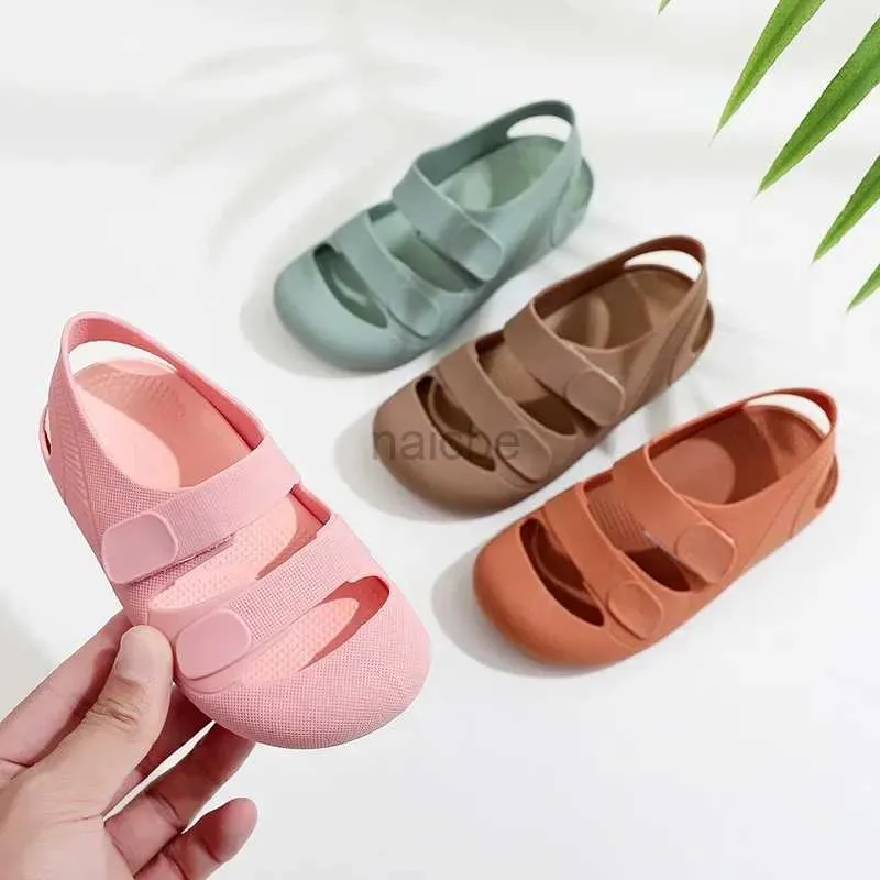 SLIPPER KINDEREN SANDALS HOLLOW OUT OUT GOTE TOE STRAND SCHOENEN BEHADBAAR Candy Color Romeinse sandalen voor jongens Girls Zachte niet-slip kinderschoenen 2448