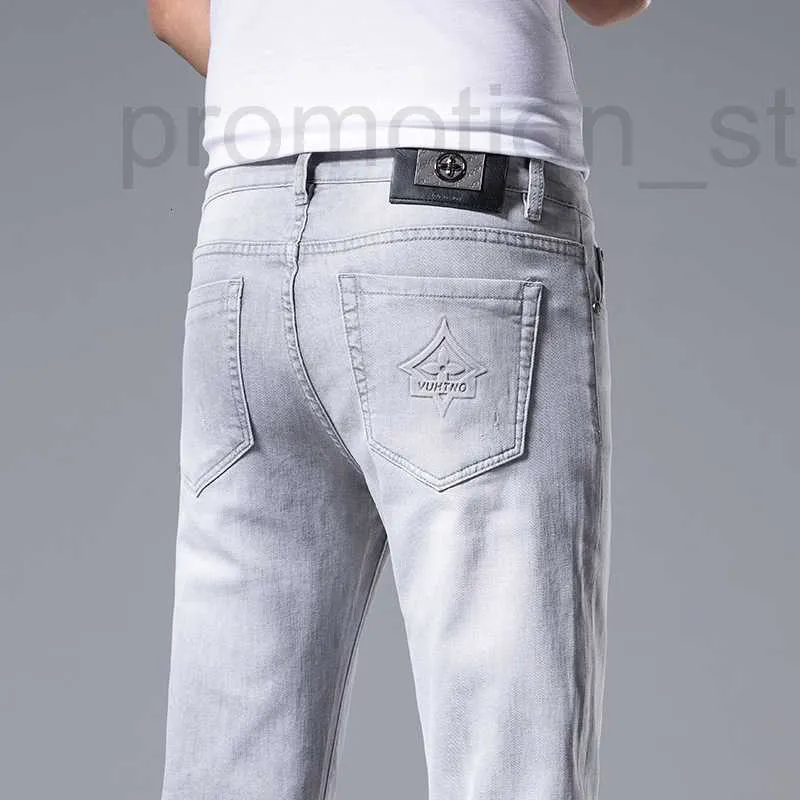 Mäns jeans designer Hong Kong jeans för mäns vår/sommar ny ljusgrå smal passform high-end casual byxor män 0vfz