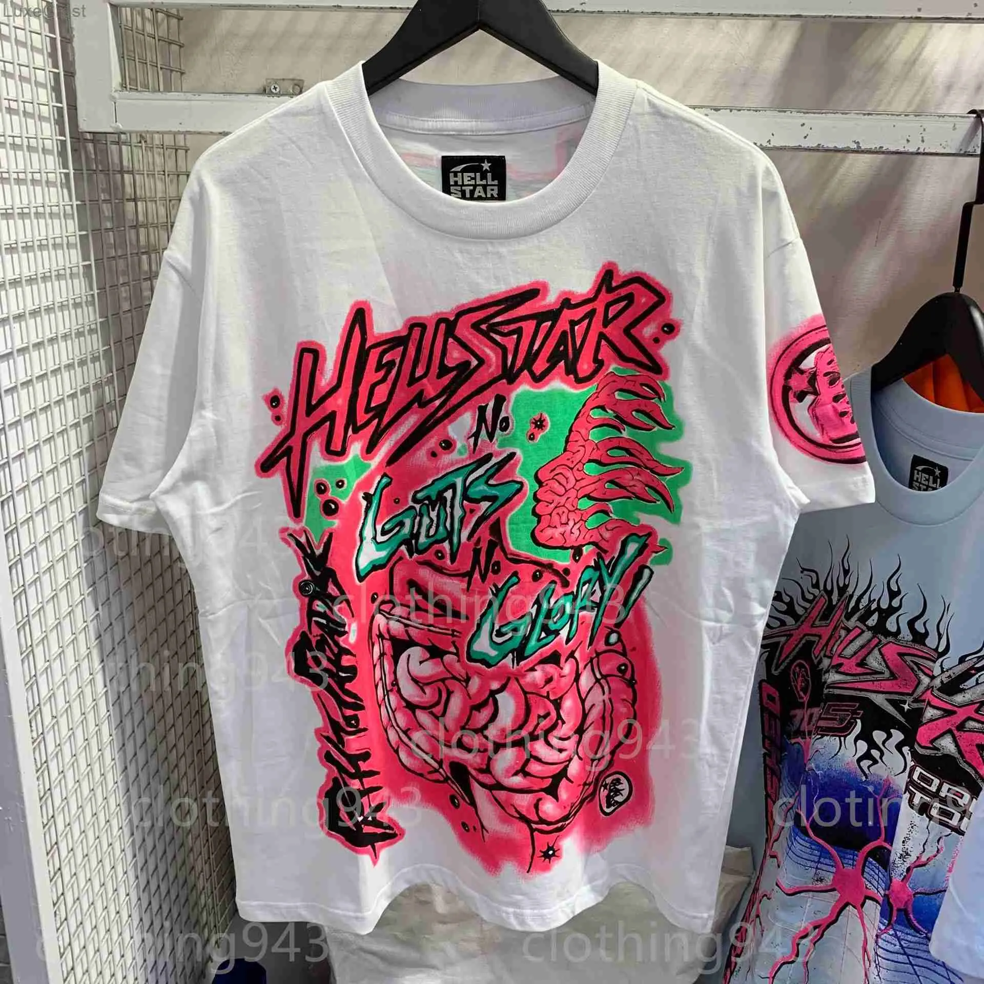 Homens de alta qualidade Camisetas Hellstar redonda Crew pescoço Designer de designer de hip hop Roupas soltas Padrão de algodão de algodão curta Mulheres principais camisetas causais de camisa