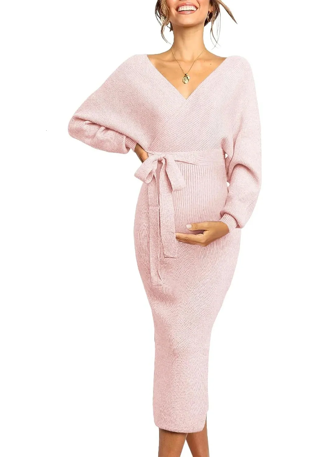Kvinnors moderskap En rosa klänning som bärs av en gravid kvinna med långa ärmar och en skinkor lindad kjol 240408