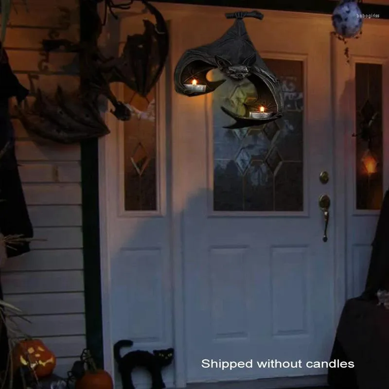 Держатели свечей висят летучих мышей на хэллоуин