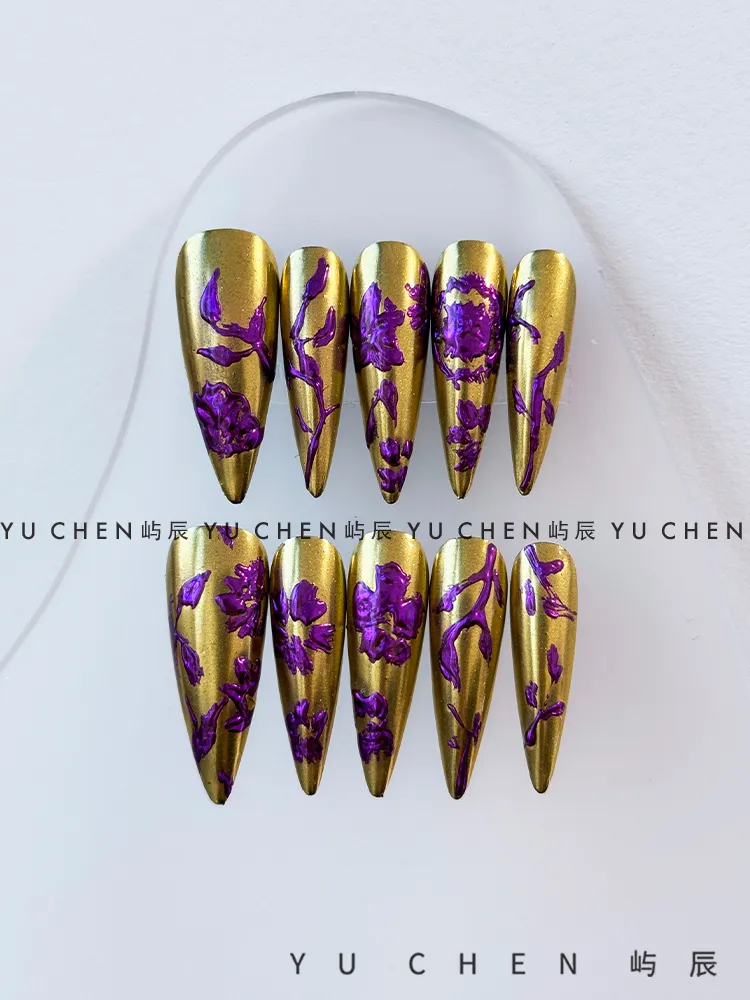 Purple and gold nail art, wearing armor, hand drawn charm, Chinese style flowers, handcrafted and stylish New Year