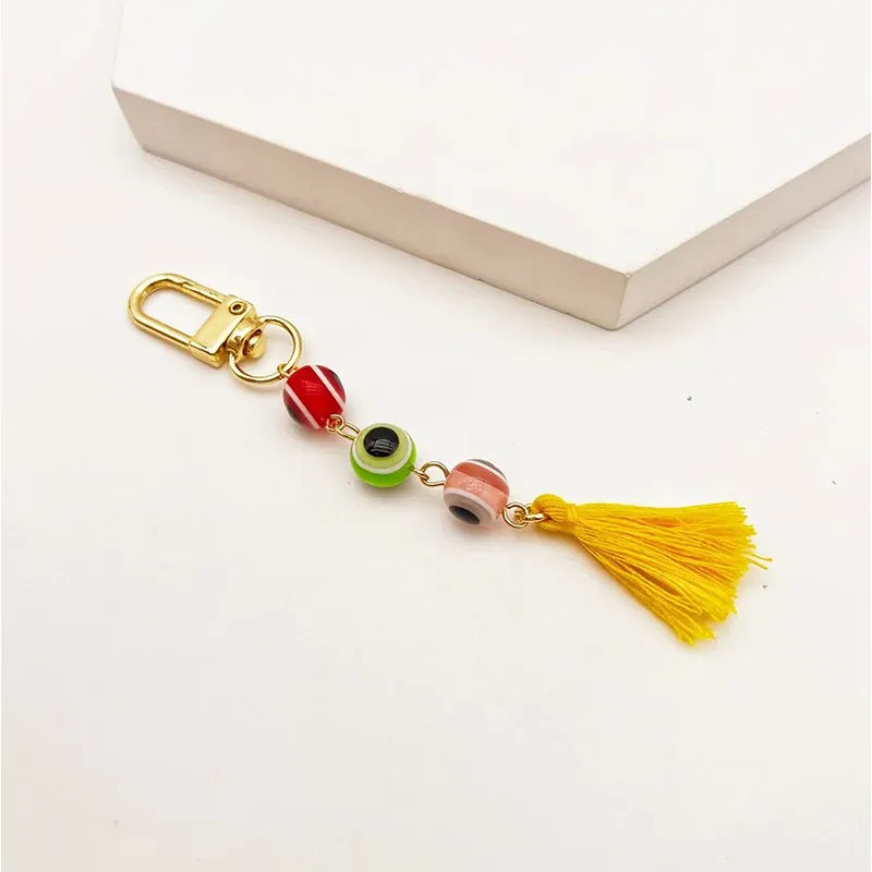 Glückliche türkische böse Eye Keychain Harz Perlen Quaste Tassel Charme Key Ring Auto Handtasche Accessoires Schmuck für Frauen Mädchen