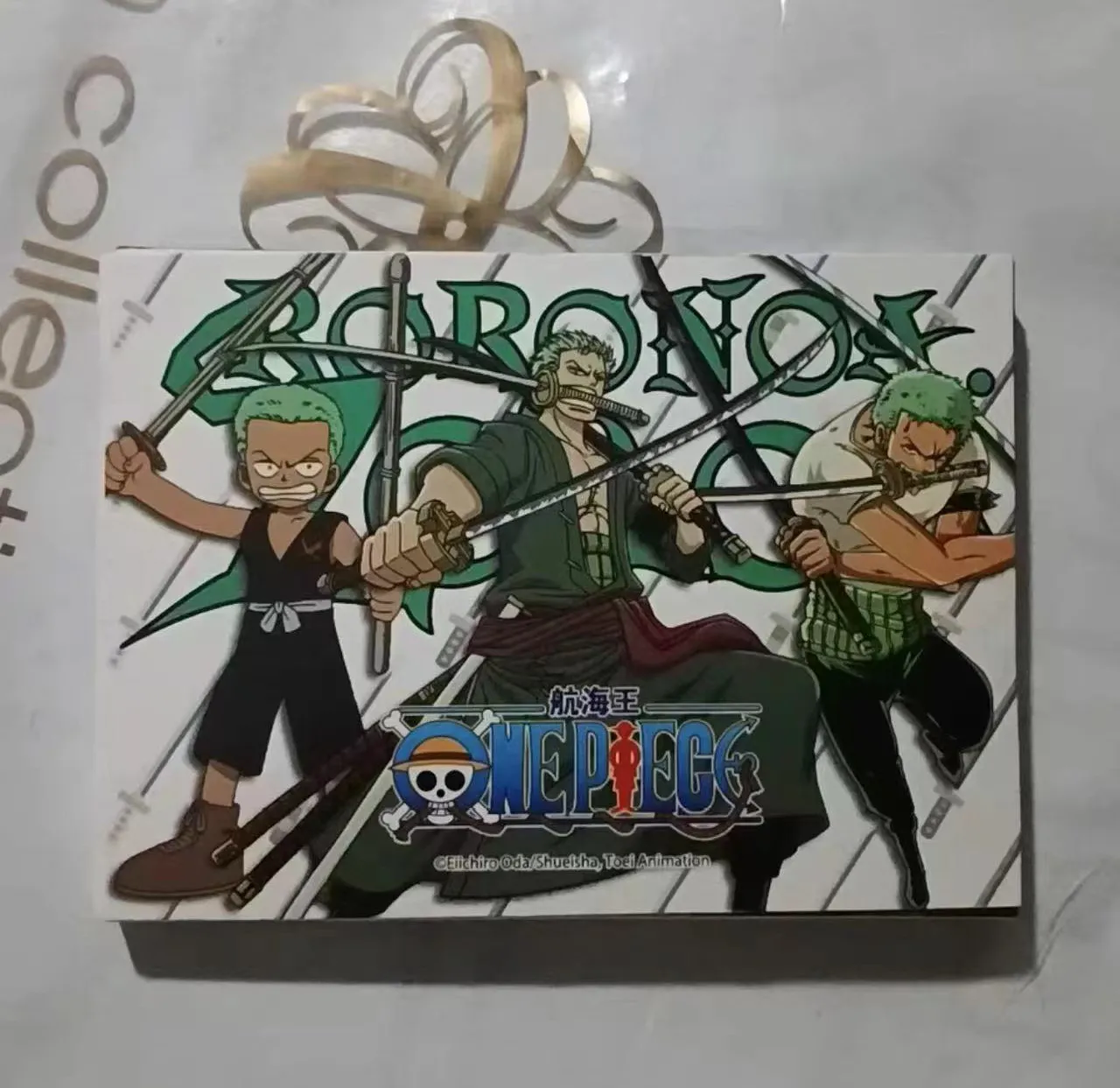 Anime Toys: Bronze Metal Card Featuring Swordsman Design