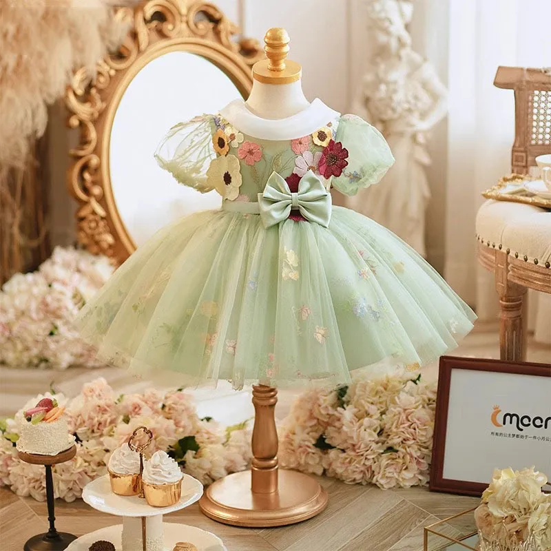 Beautiful Green Silk Baby Girl's Dress with Ruffled and Bow Accents