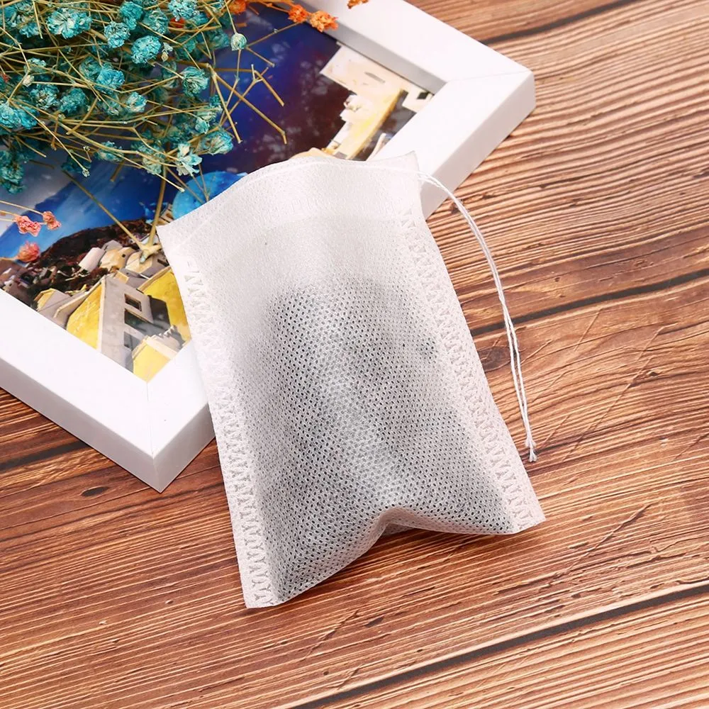 100 pcs / lot Sacs de thé ronds Sac à thé parfumés vides avec un sachet de thé en papier de santé à noyer