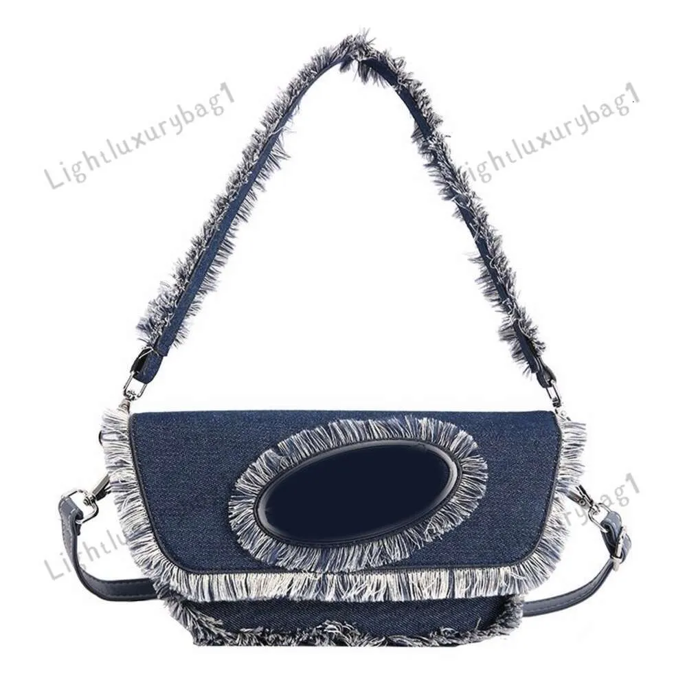 Nouveau créateur denim tassel di sac cowboy épaule crossbody sac mode sacs de main femmes baguette luxe fourre-tout