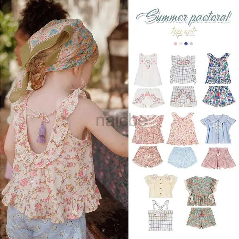 T-Shirts LM Childrens Shirts Shorts ein Set für 2024 Neue Frühling Sommermädchen Urlaub ärmellose Blumenbluse Shorts Clodings 240410