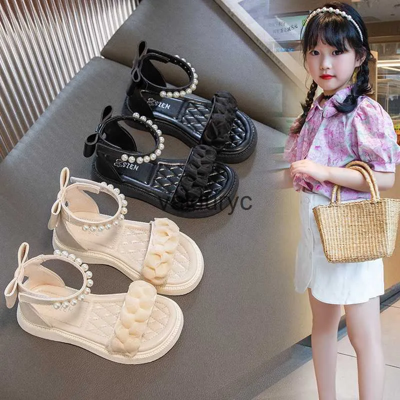 Sandaler Girls Korean Edition Bow Princess Shoes 2023 Summer New Little Girl Pearl Flat Roman Trend H240411
