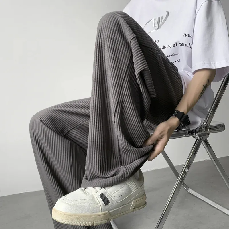 Pantaloni pieghettati estivi uomini moda pantaloni di seta di ghiaccio sovradimensionati uomini giapponesi streetwear hip-hop pantaloni dritti pantaloni da uomo 240408