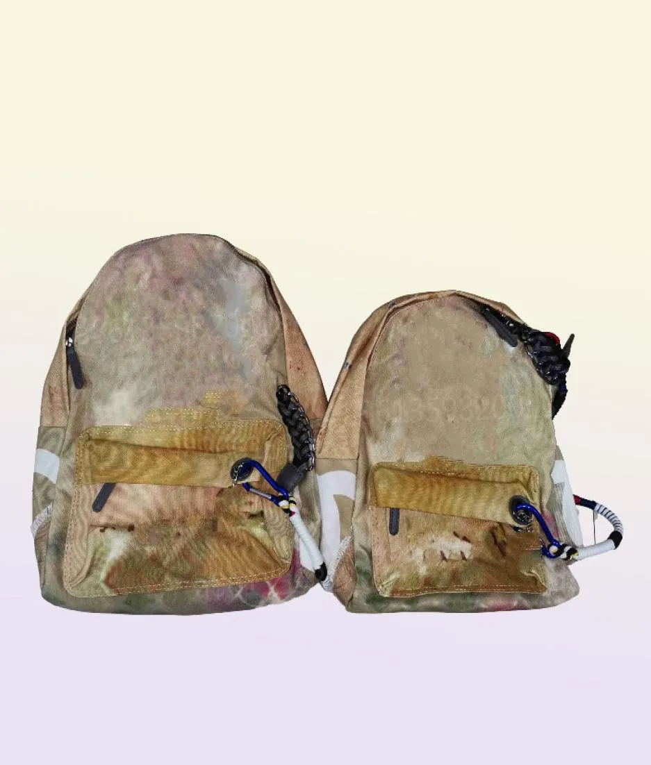 Backpacks de créateurs Classic Graffiti Sports Loison Sac à dos pour hommes et toile pour femmes Camouflage d'épissage sac à main de grande capacité Scho3503118