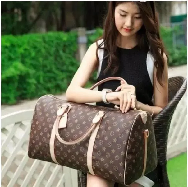 Designers fashion duffel bags luxury men female travel bags leather handbags large capacity holdall carry on luggage overnight weekender bag with lock