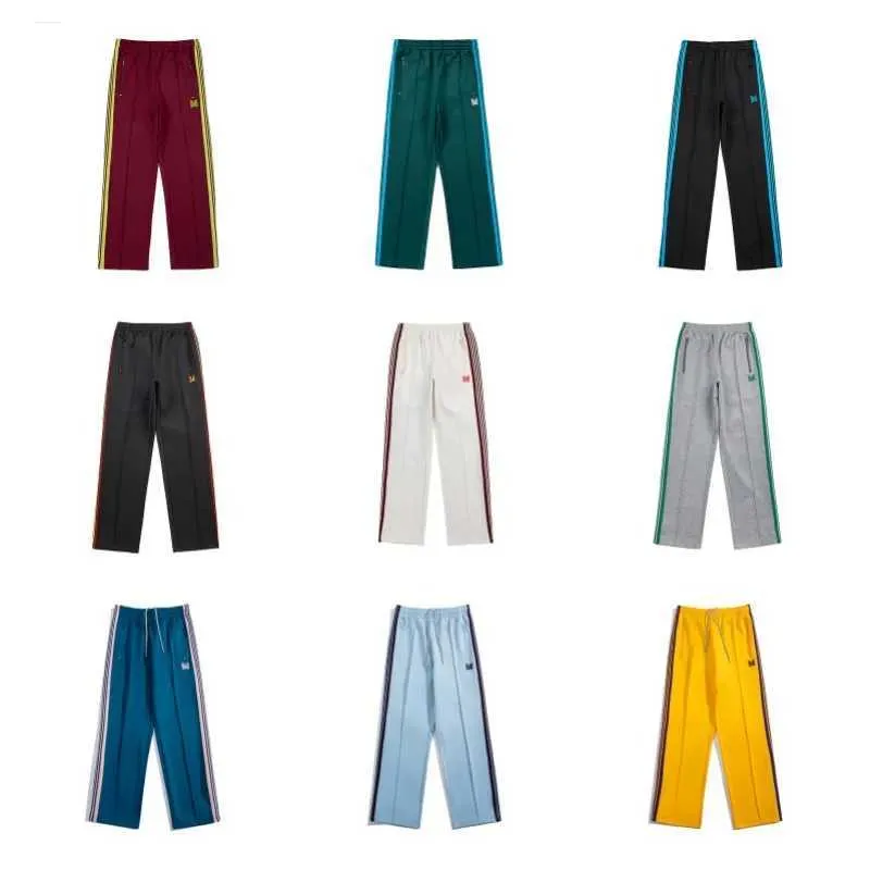 Pantalon pour hommes aiguilles marée marque papillon broderie côté pantalon rayé pantalon de jambe droite mens et pantalon décontracté pour femmes J240409