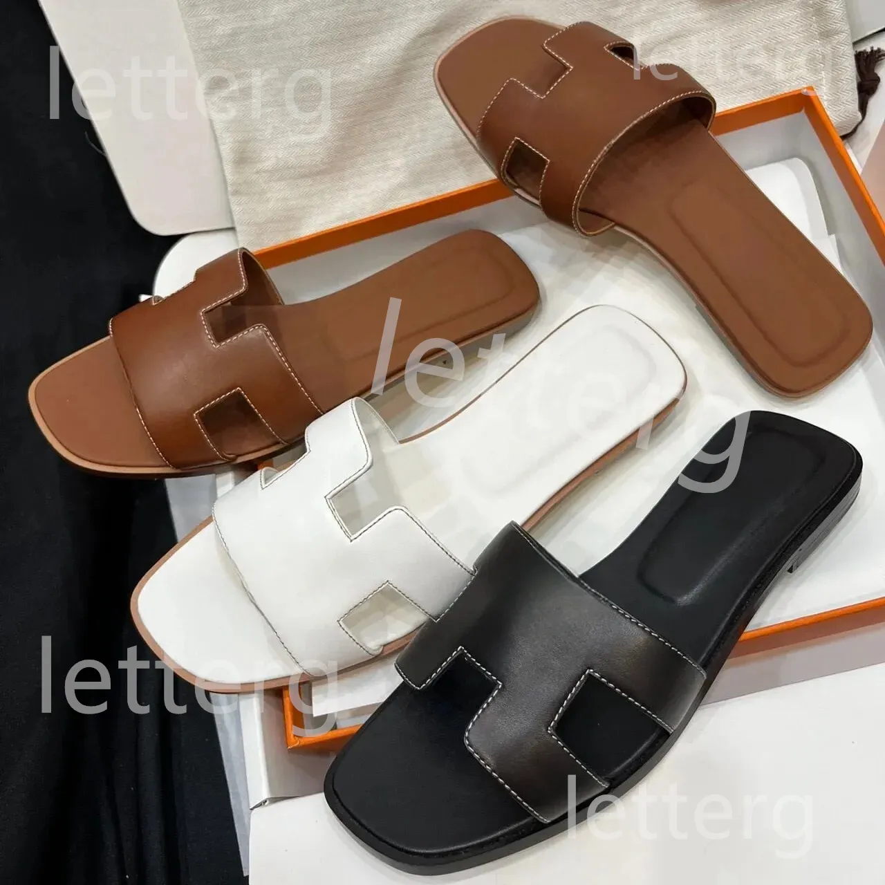 Casual tofflor läder sandaler sommar lat designer sandal tecknad öppen tå oran flip flops läder dam glider män kvinnor skor storlek 35-42