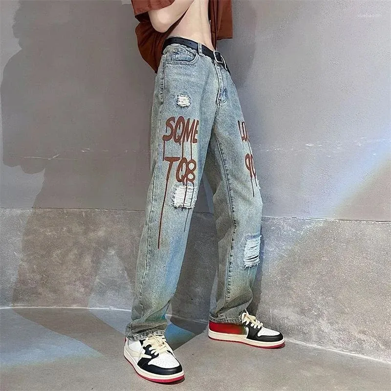 Jeans masculinos rasgaram calças de cowboy broken com letras impressas calças rasgadas buracos de hip hop 2024 Trendência empilhada com moda