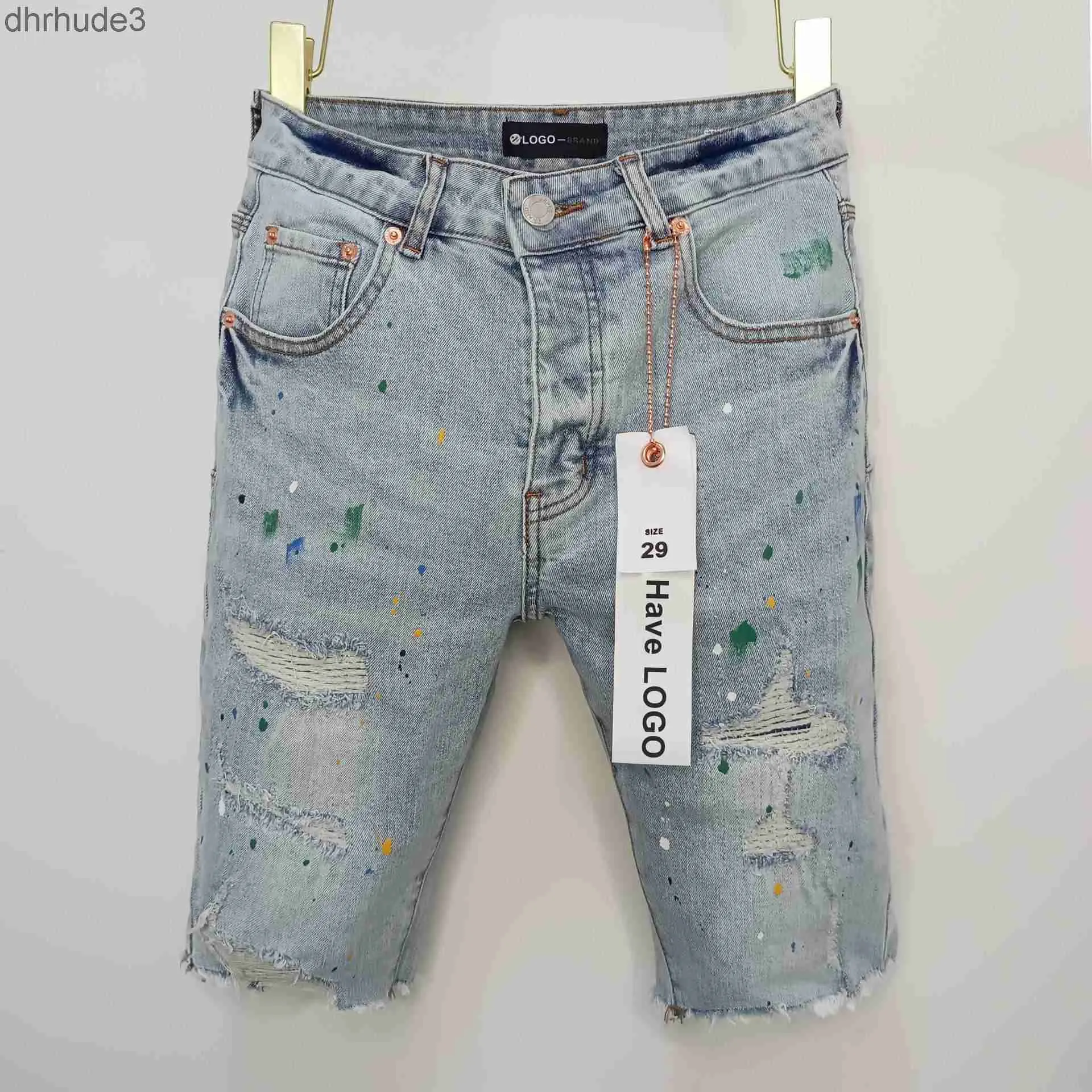 Tendance de streetwear de marque violette avec encre éclaboussée et shorts en jean déchirés pour les hommes en été 6lxi