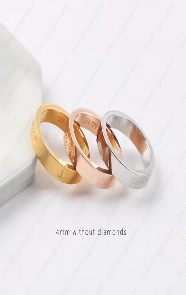 ダイヤモンドと電気めっきされた18kのゴールドファッショナブルなカップルを備えた金色のリングは、軽い高級ジュエリーを備えています5602810