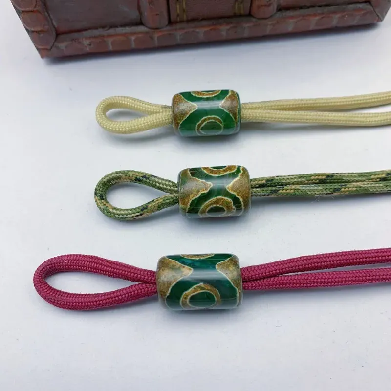 Tibetansk stilcylinderpärlor paracord pärla charm 3 ögon tibet amulet pärla diy paracord lanyard pärla charm för vikkniv