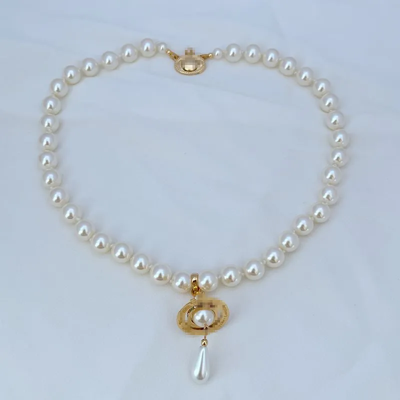 Lady Designer Saturn Charm kettingen zilver en gouden waterdruppelvormige parelketting