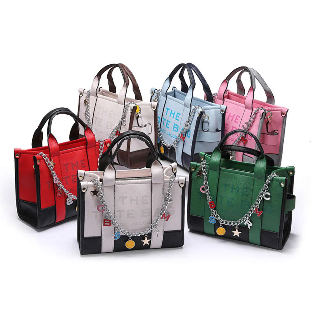 Handbag Designer 50% Discus sur les sacs féminines de marque chaude Nouveau sac fourre-tout de grande capacité couleur Handheld Womens épaule crossbody