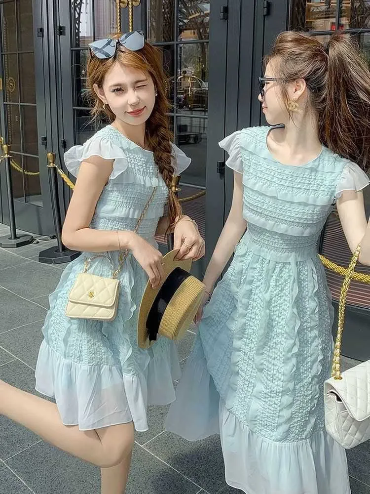 Huangunique och trendig design med en nischkänsla hög midja klänning för kvinnor sommarte bryta franska avancerade utsökta lilla kjol