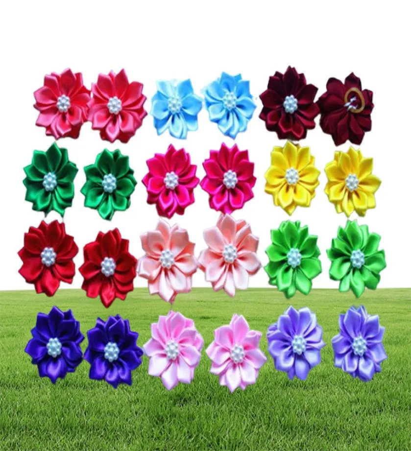 Abbigliamento per cani 100pcslot pet peli archi elastici fiori di petalo con accessori per la toelettatura perle Prodotto 2695268