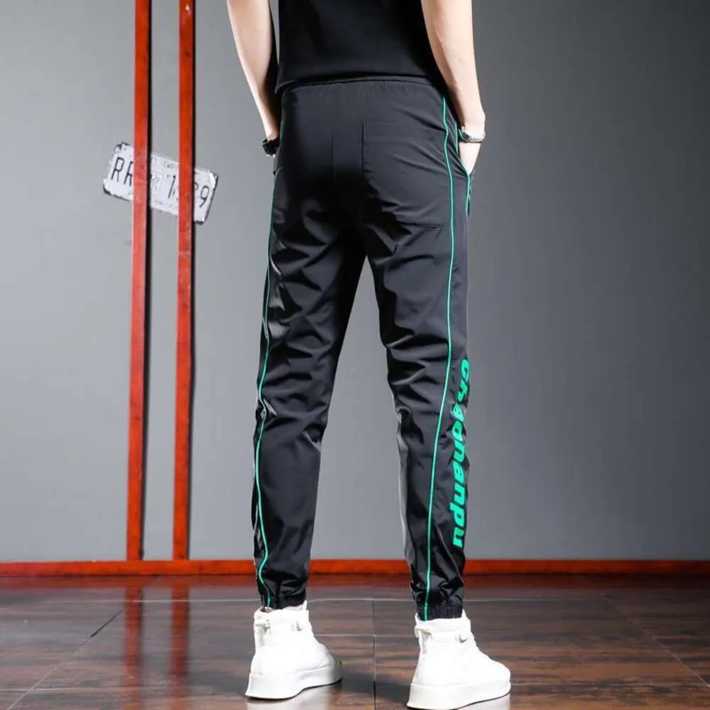 Zomer dunne ijs zijden casual broek, snelle drogende broek voor heren, gestreepte letterafdruk, zwarte sport elastische leggings, lange broek