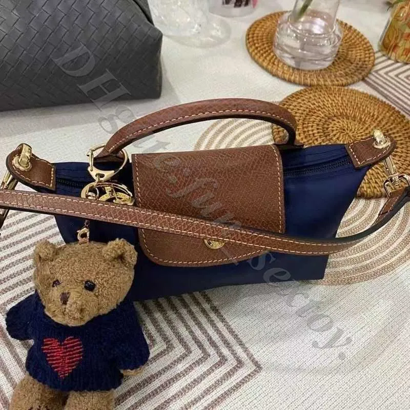 Mini Lüks Crossbody Tasarımcıları Cüzdan Çanta Koşulumu Perakende Kırmızı Mavi Çanta Orijinal Deri Toptan Femme Çanta Dumpling Tasarımcı Küçük Çantalar Makyaj Çantaları