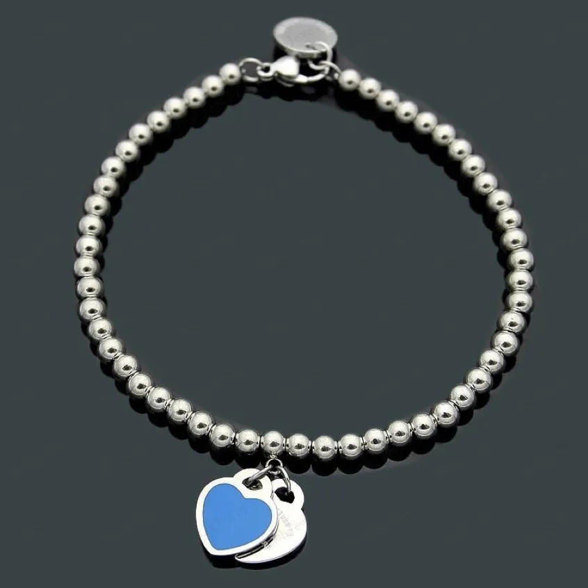 Designer Luxury Heart-Shaped Pendant Halsband Armband Kvinnor Rostfritt stål Par Pendantsmycken Valentinsdag GI209F