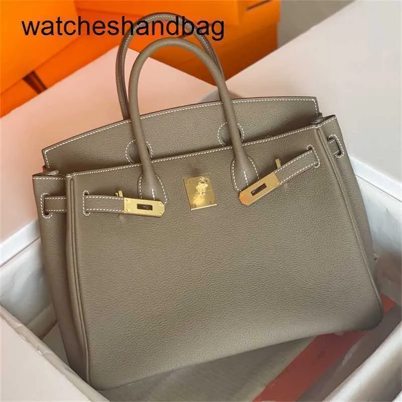 حقيبة مصممة للنساء من الجلد الأصلي 7A Handswen Through Togo Calfskin Lock Handbag Leather 25 400xg7