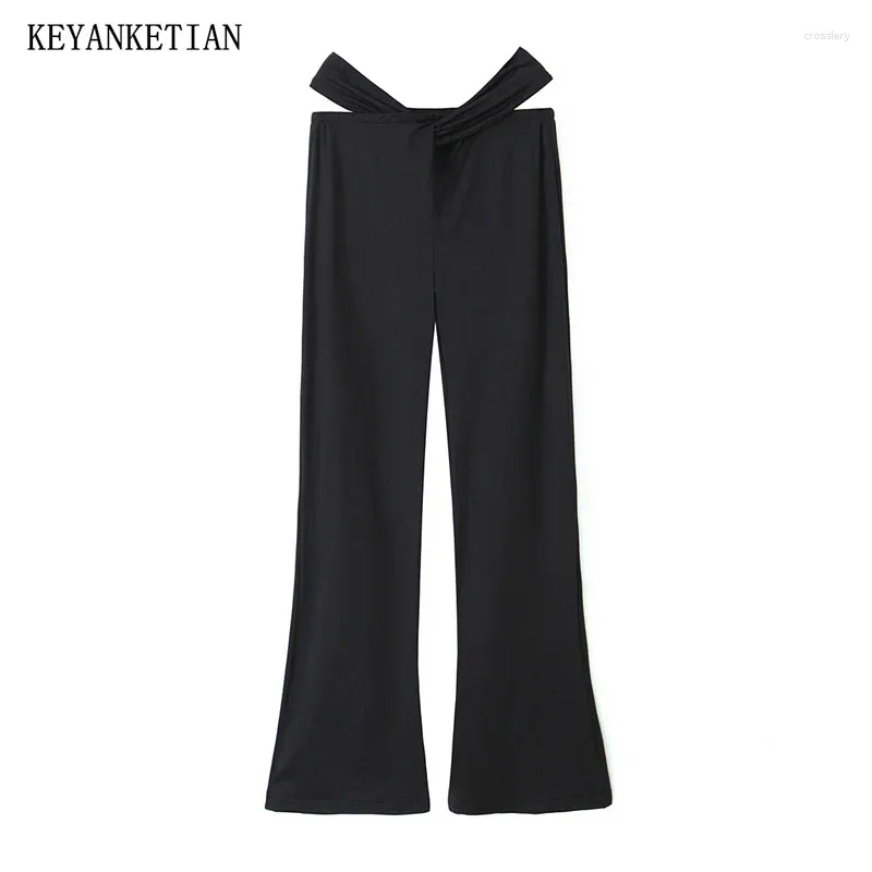 Pantaloni da donna Keyanketian 2024 Lancio Scava per pantaloncini a campana a vita bassa sexy elastici pantaloni neri sottili