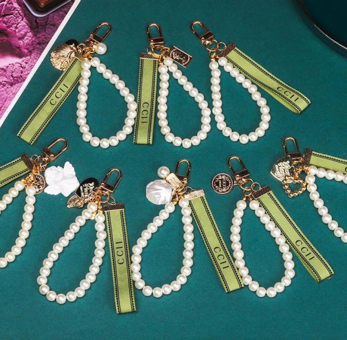 Trendy KeyChain Luxury Designer Keys Pendant Key Buckle Classic Letter Fabric Pearls Chain 4 Styles Högkvalitativa nyckelringar Bag Orn4910815