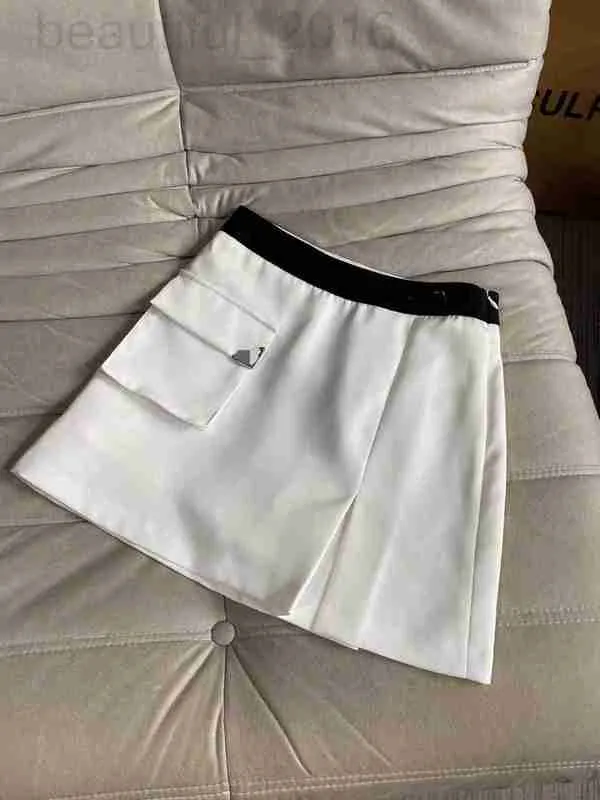 Kjolar designer Shenzhen Nanyou 23 vår/sommar modeålder och reducerar triangelficka bokstaven vävande band hög midja a-line nylon kjol v6mu