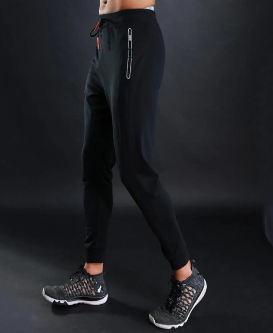 Oddychające spodnie do joggingów Mężczyźni Fitness Joggers Running Pants z kieszonkowym sportem do prowadzenia piłki nożnej tenisowej 9740783