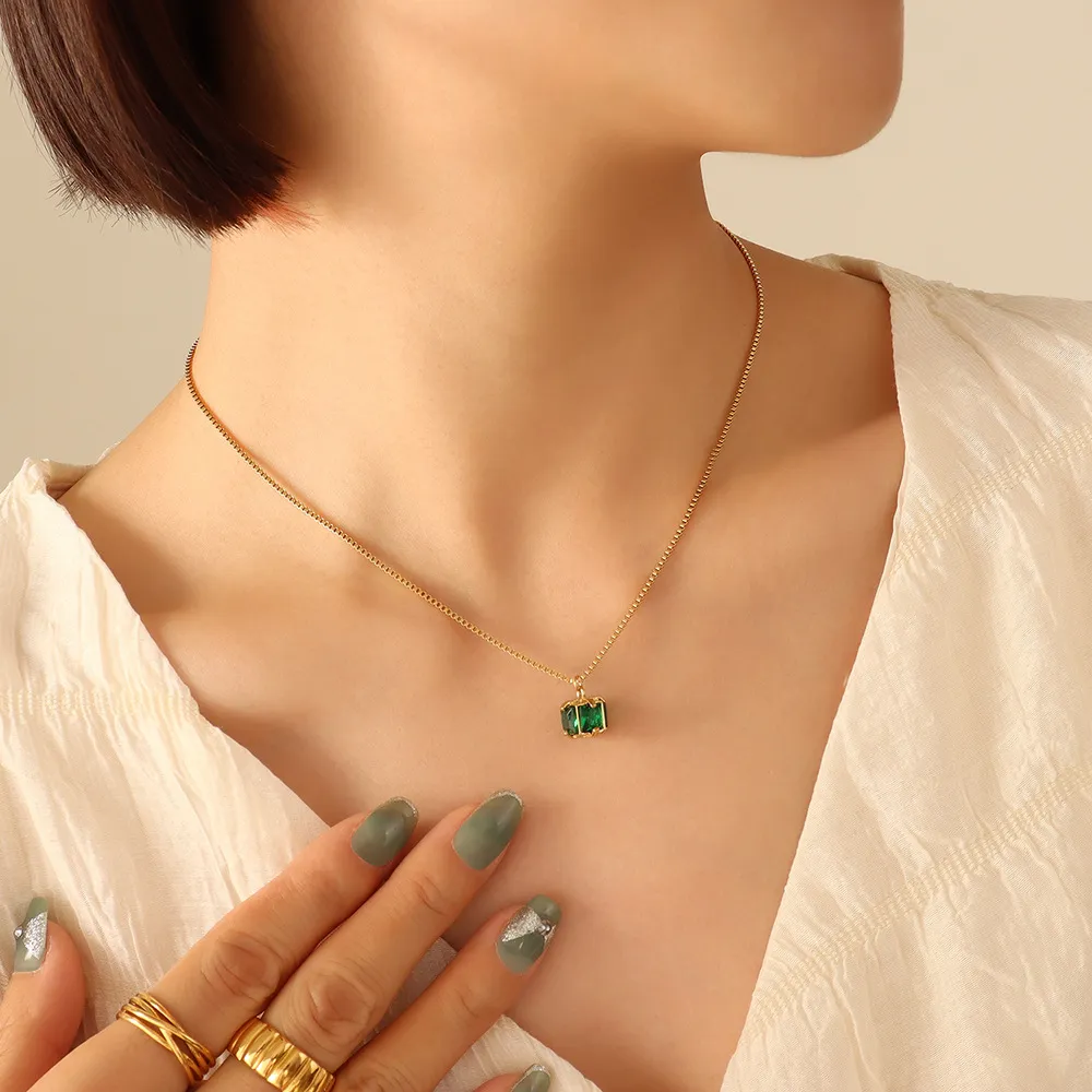 Cold and aloof style niche design non fading titanium steel four claw clasp emerald zircon necklace earrings jewelry set