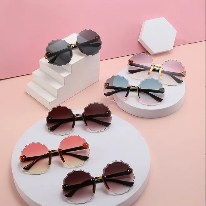 Retro zonnebrillen kinderen rond golvende bloemen frameloze zonnebril voor meisje/jongensmerk ontwerper brillen uv400 oculos de sol