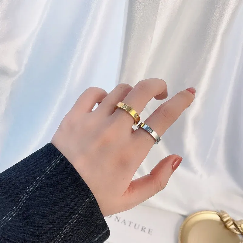 Modne błyszczące pierścionki cyrkonowe stal nierdzewna Rose Gold Love Pierścień dla kobiet/mężczyzn Pierścienie Pinę Luksusowa marka biżuteria Pure Srebrna Pierścień Wyjęte z 18 -karatowym złotym pierścieniem rozmiar 5 do 11