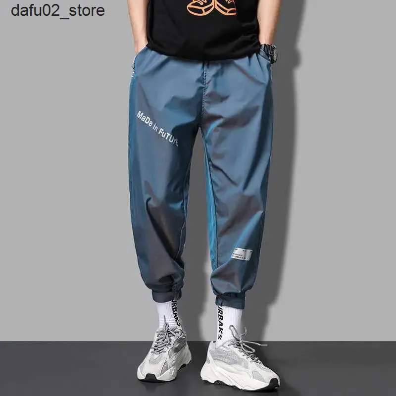 Pantalons masculins Joggers hommes Streetwear Techwear Pantalon Casual-Helle Longle Reflèteux Pantalons de survêtement imperméables mâle 2023 Corée Fashion Q240417