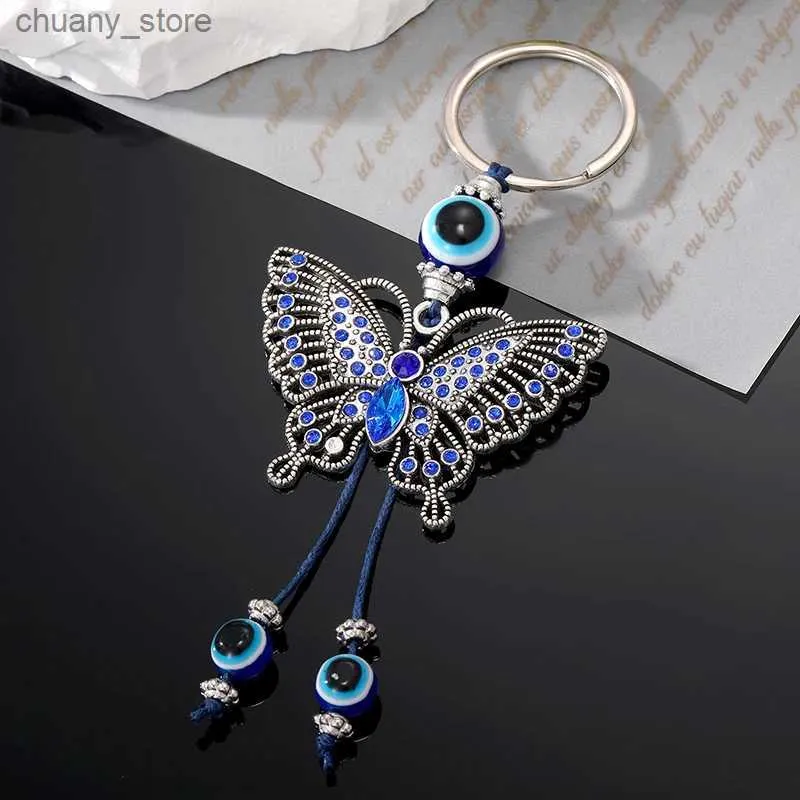 Keychains Lonyards cristal dinde bleu œil perle papillon animal clés de trèfle pour femmes insectes méchants sacs accessoires de voiture en gros de bijoux y240417