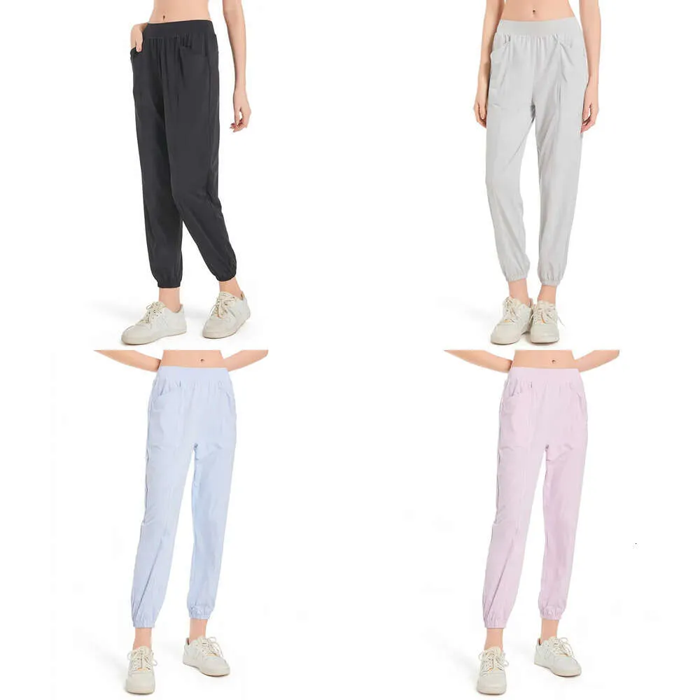 Vrouwen ll joggen yoga negende big pocket fiess zachte hoge taille heup lift elastische casual broek beurt benen joggingbroek lichte kleuren voor de zomer