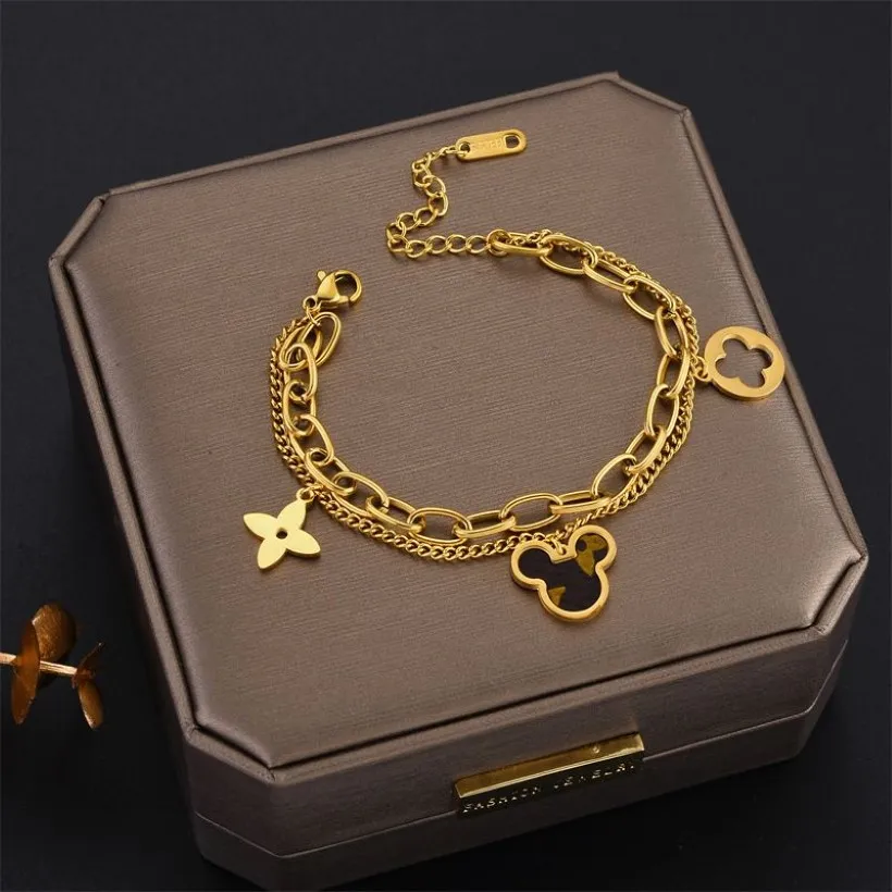 Bracelets de braceletes de trevo de quatro folhas Conjunto de jóias de garanhão de pulseira dourada Mãe de cadeias de flores verdes de pérola Link Womens283U