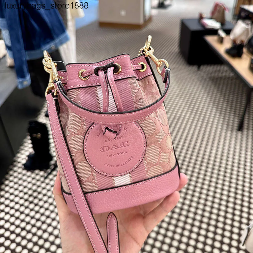 Fabrika Yüksek Kalite% 75 İndirim Toptan 2024 Bahar Yeni Kadın Çantası Dempsey Buck Drawstring Tuval Bir Omuz Crossbody