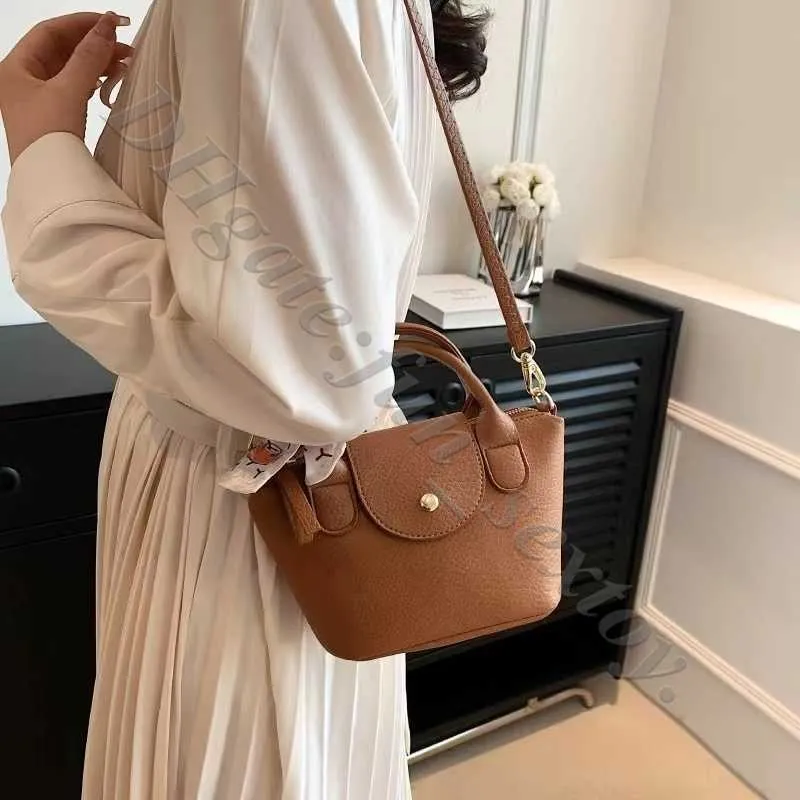 Detaljhandels grossistdumpling purses crossbody butikspåsar 95% rabatt handväska designer handväska franska lammskinn cross wing saccoche väska lamm hud mini handväskor gqxn