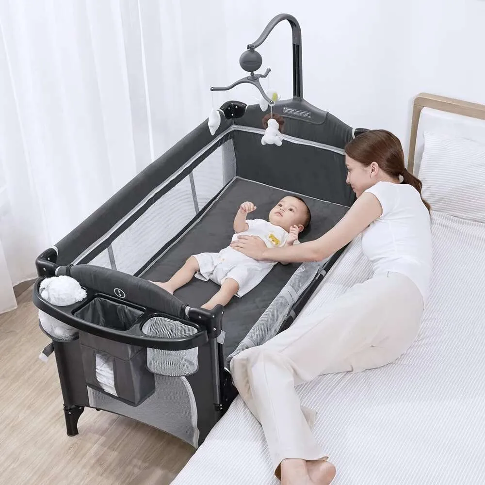 DHgate 5 in 1 Baby Bassinet Bedside Sleeper with Rocking Feature Portable Playard with Mattress Diaper Changer and Music Mobile Easy Folding Design Toys Gifts