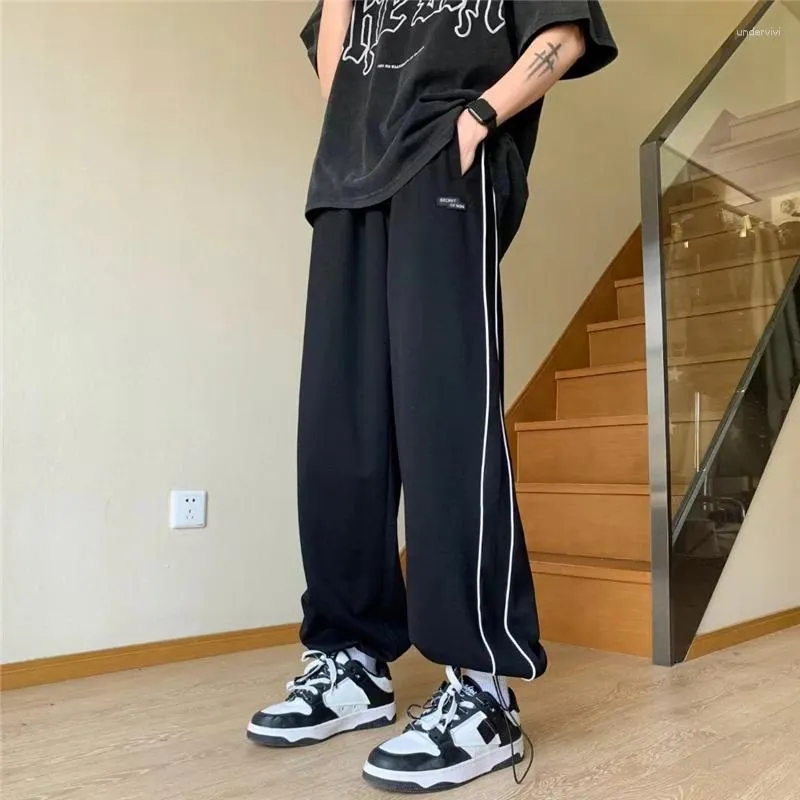 Pantalon masculin 2024 Tendance de printemps Tracksuit Corseted pieds décontractés tout le tout sous-pants