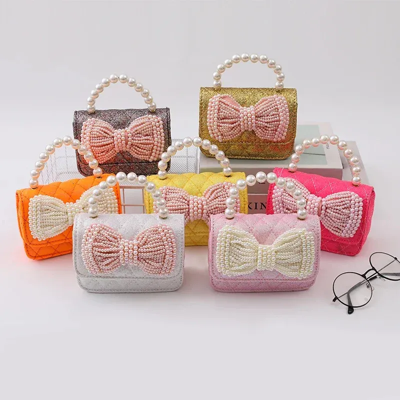 Klassische Geldbörsen und Handtaschen rosa glänzende Kindertasche und Bogen Mini -Handtaschen verkaufen Seitenbeutel für Mädchen 240418