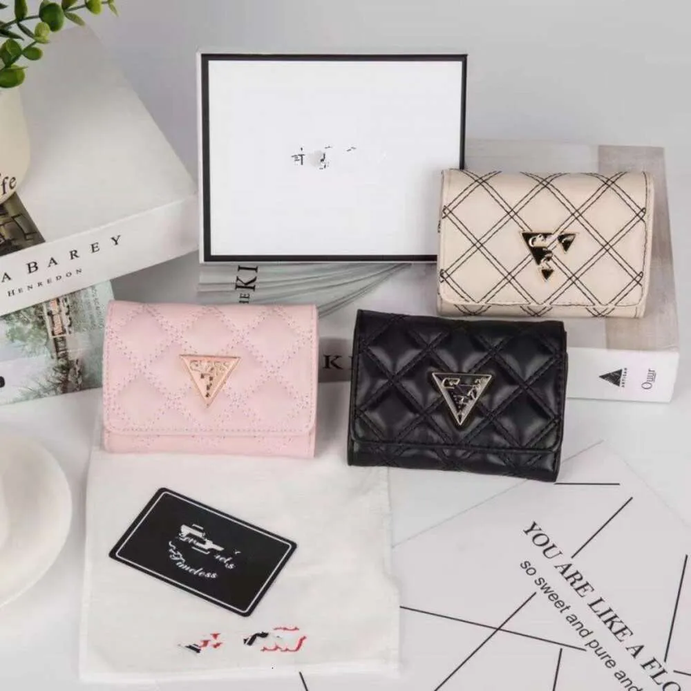 El çantası tasarımcısı sıcak satış% 50 indirim cüzdan erkekler için deri kadınlar yeni basit para çantası kısa cüzdan üçgen elmas desen belge düz renk sıfır